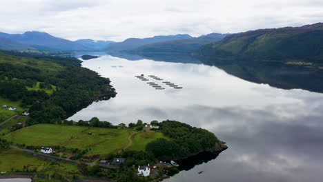 Wide-drone-shot-of-mountains-and-water-in-Loch-Carron,-in-the-Scottish-Highlands