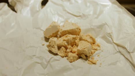 Crushed-Fresh-Baker's-Yeast-Block-On-A-White-Wrapper