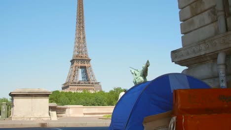 Homeless-Tent-Under-The-Bir-Hakeim-Bridge-Overlooking-Eiffel-Tower-In-Paris,-France