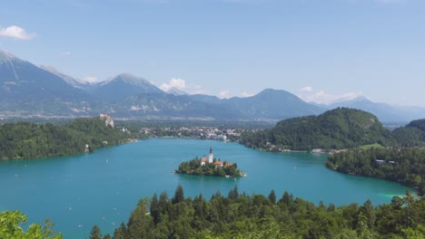 Panoramic-View-of-Lake-Bled-and-its-Castle-Island-from-a-High-Viewpoint-During-a-Sunny-Summer's-Day