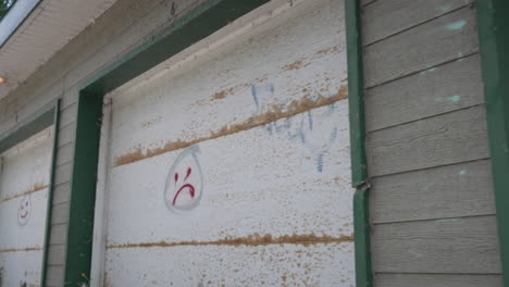 Camera-moving-forward-to-reveal-graffiti-work-on-the-wall-of-a-Garage
