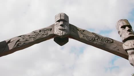 Wooden-Totem-Arch-Gate-Against-White-Sky