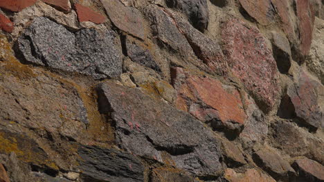 An-ancient-stone-wall-close-up-view-that-enhancing-the-beauty-of-Museum-fortress-Korela,-Russia