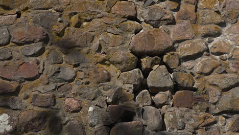 A-close-up-view-of-an-ancient-and-gorgeous-stone-wall-of-Museum-fortress-Korela,-Russia