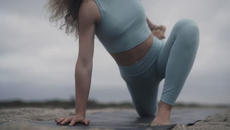 Complicated-yogi-stretches-outdoors-for-flexibility