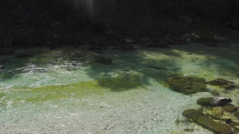 A-Close-Up-Shot-of-a-Tropical-Looking-Clear-Water-of-the-River-Soča-in-Slovenia