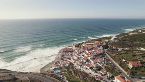 Azenhas-Do-Mar-coastline-cliff-town-in-Portugal-seaside,-aerial-drone-view