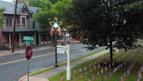 American-flags-on-lawn-in-American-town-honoring-veterans-and-those-who-served
