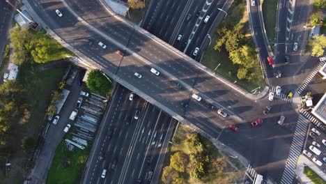 4K-drone-top-down-shot-of-high-frequented-Pan-American-Highway-and-busy-bridge-on-top---Buenos-Aires,-Argentina