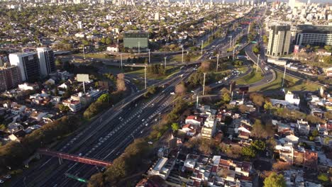 Aerial-drone-view-over-Pan-Americana-Highway-in-Buenos-Aires-at-dusk,-Argentine