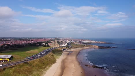 Aerial-Shot-of-Tynemouth-Long-Sands-Beach-on-a-Warm-Summer-Day---Drone-4K-HD-Footage-Backwards
