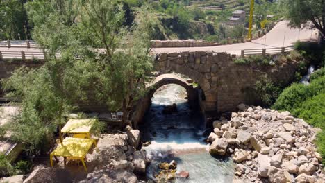 Stream-Flowing-From-The-Mountains-In-Afqa-Lebanon---aerial-shot