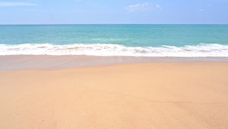 Empty-Wild-Yellow-Sand-Beach-with-Beautiful-Sea-Waves-Coming-Toward-Beach-Daytime