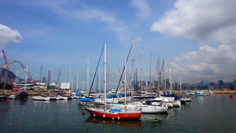 Boats-Floating-On-Calm-Waters-Of-Sea-At-Victoria-Harbour-In-Hong-Kong,-Timelapse