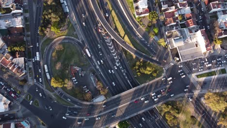 Aerial-image-of-Unidentified-cars-passing-fast-over-the-Pan-American-highway-in-Buenos-Aires,-Argentina-during-day-time