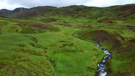 Flyover-Flowing-Steam-River-In-Reykjadalur-Valley-Near-Reykjavik,-South-Iceland