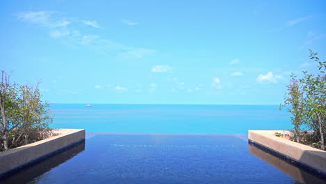 Rooftop-private-Infinity-pool-in-the-exotic-hotel-with-a-great-view-of-the-endless-sea-at-daytime-in-Thailand