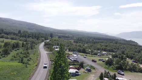 Campground-in-Hallormsstaður-national-forest-in-Iceland-on-sunny-day,-aerial