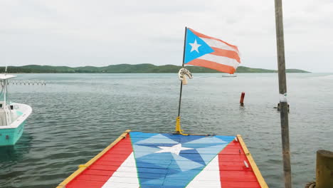 Pontoon-painted-with-flag-of-Puerto-Rico-as-national-flag-flaps-in-wind