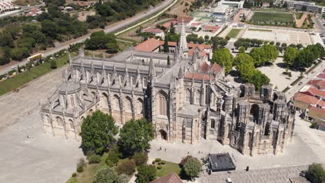 Cinematic-birds-eye-view-overlooking-at-the-front-facade-of-historic-gothic-style-Batalha-monastery
