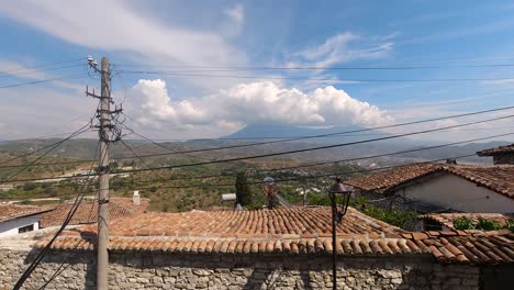 Timelapse-over-typical-Mediterranean-village-with-high-mountain-in-distance