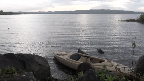 A-kayak-docked-on-the-shores-of-Lake-Victoria-in-the-early-morning-sun