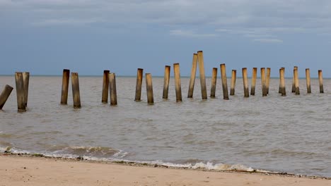 Abstract-Concrete-Pillars-and-Columns-from-an-Old-Pier-Along-the-Coastal-Beach-in-Thailand