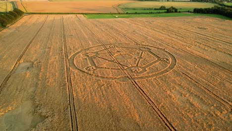 Fortnite-molecular-atom-crop-circle-design-sunset-harvest-meadow-aerial-drone-view-in-Wiltshire-push-in-to-Birdseye