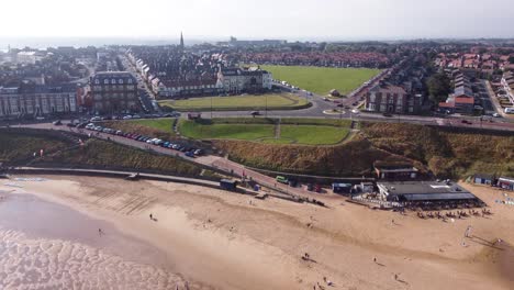 Aerial-Shot-of-Tynemouth-Beach-on-a-Warm-Summer-Day
