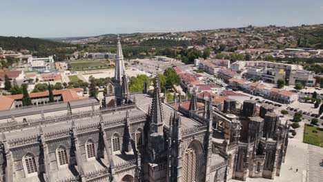 Aerial-backwards-view-of-the-monastery-of-Batalha,-with-some-details-of-gothic-roof