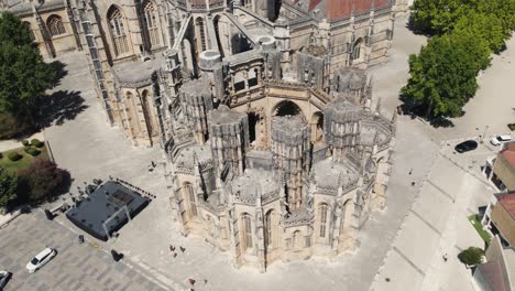 Majestic-building-of-Batalha-Monastery,-aerial-orbit-view