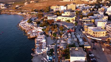 Coastal-City-Of-Anfeh-In-Lebanon-At-Sunset---aerial-drone-shot