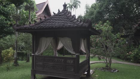 Traditional-wooden-Thai-pavilion,-designed-for-people-to-sit,-relax-and-escape-the-heat,-Botanical-Garden,-Thailand