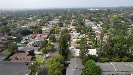 Pasadena-aerial-view-above-urban-residential-district-neighbourhood-real-estate-streets-moving-forward