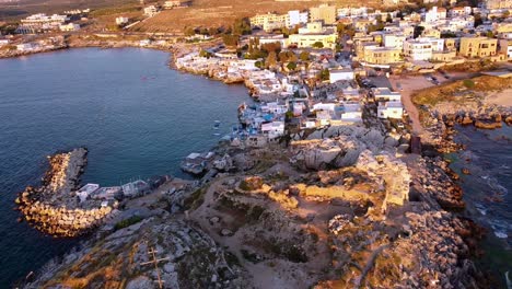 Aerial-View-Of-Rugged-Coastline-And-Buildings-In-Anfeh,-Lebanon