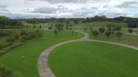 Drone-flying-forward,-revealing-an-enormous-park-and-green-environment-belonging-to-Wilma-Rudolph-Event-Center-in-Clarksville,-Tennessee-neighborhood,-USA