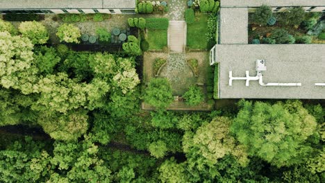Aerial-still-via-drone-of-an-overgrown-and-green-summer-garden