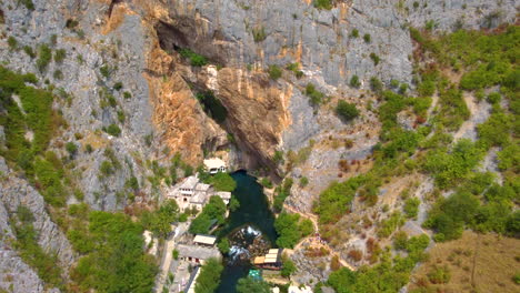 Rural-Settlement-With-Towering-Rocky-Cliffs-At-Blagaj-Village-In-Bosnia-and-Herzegovina