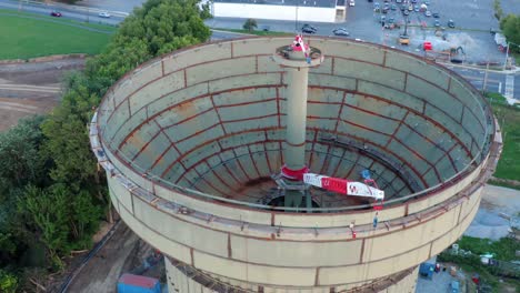 Aerial-tilt-down-reveals-water-tower-under-construction