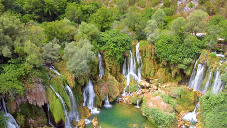 Aerial-View-Of-Kravica-Waterfalls-With-Bright-Green-Trees