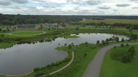 Aerial-birds-eye-view-of-Fishing-Pond-and-Wilma-Rudolph-Event-Center-at-popular-city-park---Liberty-Park,-Clarksville,-Tennessee,-USA