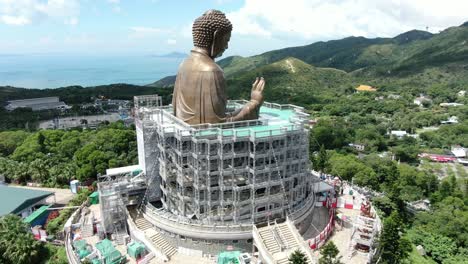 Hong-Kong-Nong-Ping-big-Buddha-and-surrounding-lush-green-environment,-Aerial-view