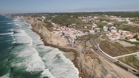 Long-strong-waves-crash-on-coastal-rocks-and-cliffs,-Azenhas-do-Mar,-Portugal