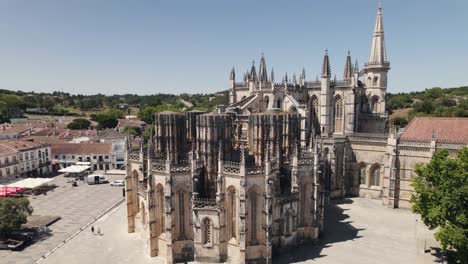 Unesco-building-of-Batalha-Monastery,-facade-aerial-orbit-view