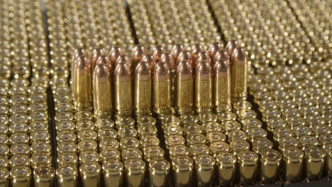 Dolly-out-of-9-millimeter-bullets-standing-on-loads-of-new-ammunition