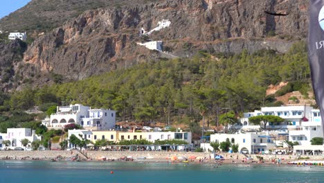 Agios-Ioannis-building-in-a-cliff-by-the-beach,-Greece