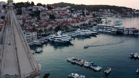 Harbor-Of-Old-Adriatic-Island-Town-Hvar-In-Croatia-During-Sunrise---aerial-drone-shot