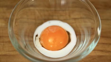 Milk-is-being-poured-on-an-Egg-Yolk-to-make-egg-wash