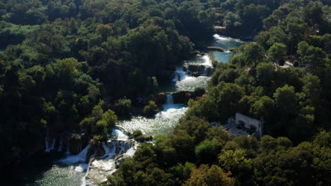 Amazing-View-Of-The-Natural-Krka-Waterfalls---Sunny-Day-View-Of-The-Krka-National-Park-Located-By-Roski-Slap-In-Croatia---aerial-pullback
