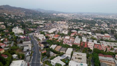 Aerial-view-of-traffic-and-buildings-in-West-Hollywood---circling,-drone-shot